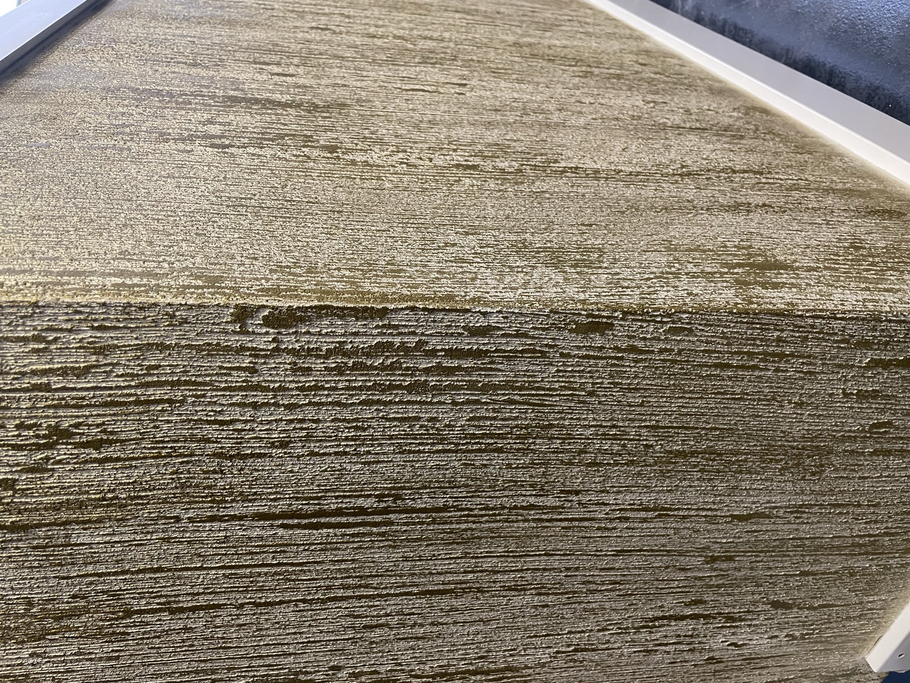 Gocce D'Oro wandafwerking met gouden druppelvorm textuur